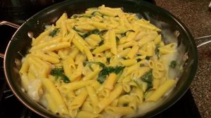 Cauliflower sauce with corn pasta with spinach and shallots